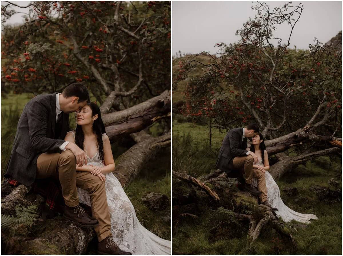 Couple sitting close on a fallen tree at Fairy Glen, Isle of Skye, surrounded by rowan trees heavy with red autumn berries