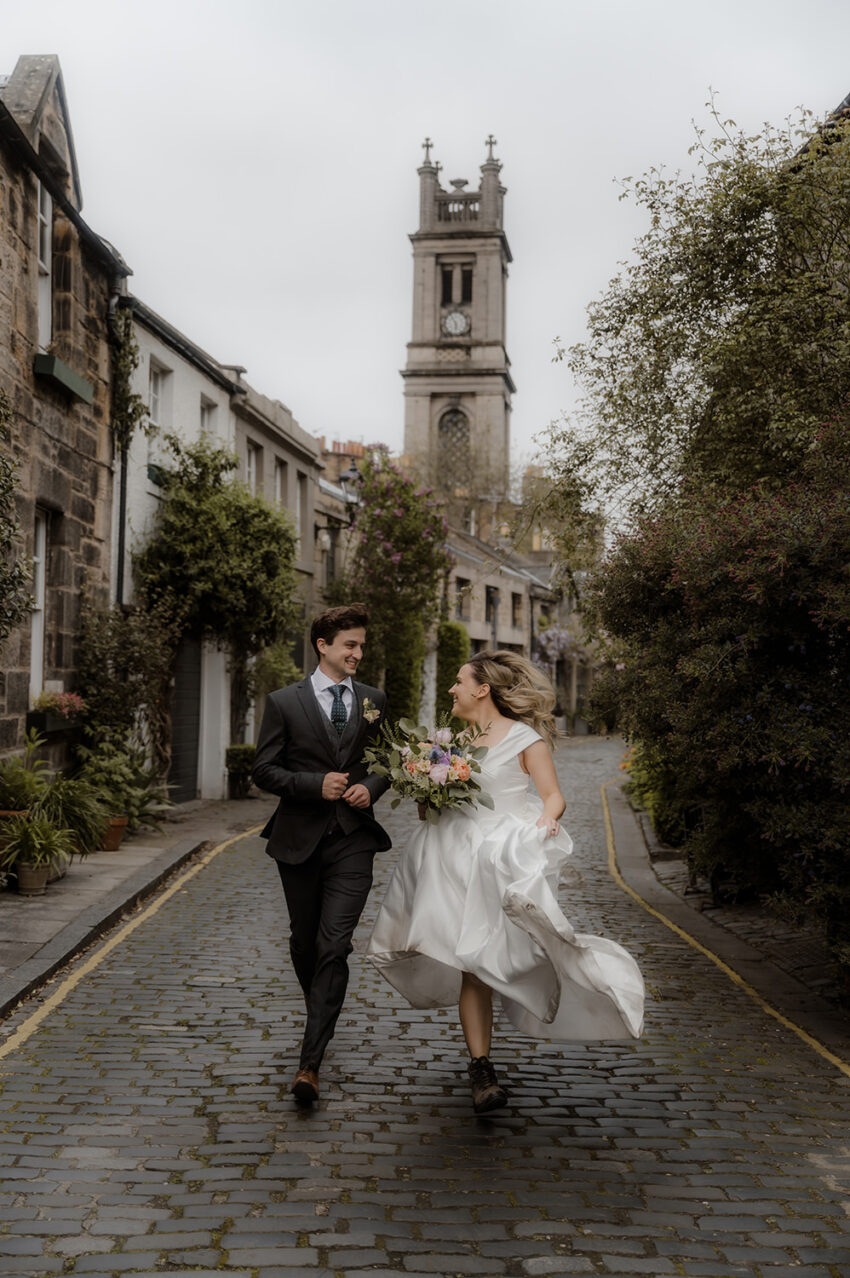 Couple running on Circus Lane - wedding photoshoot in Edinburgh