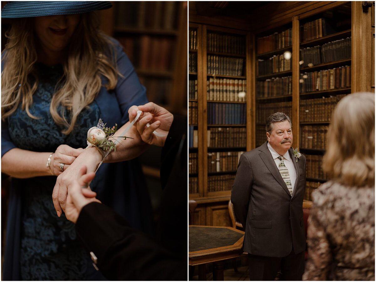 Wedding guests helping mother of the bride place a flower corsage on her wrist; guests waiting for the ceremony to commence