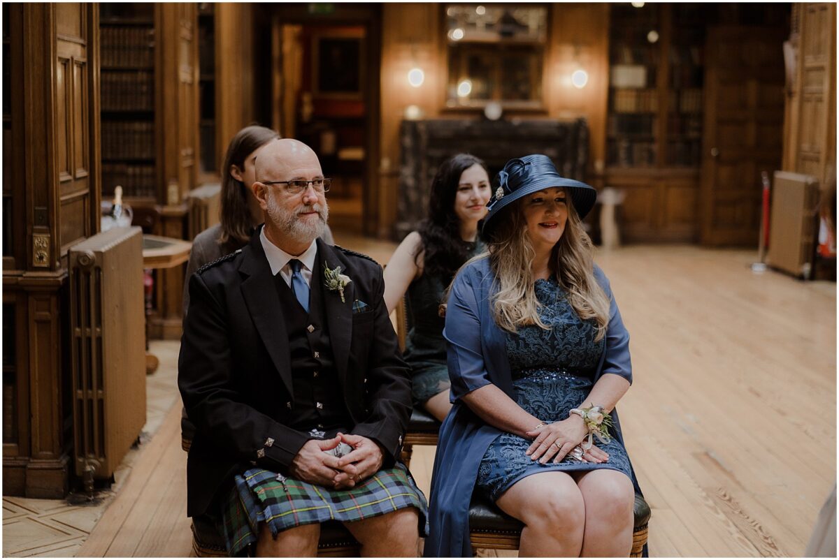 Parents of the bride sitting in the first row observing the ceremony