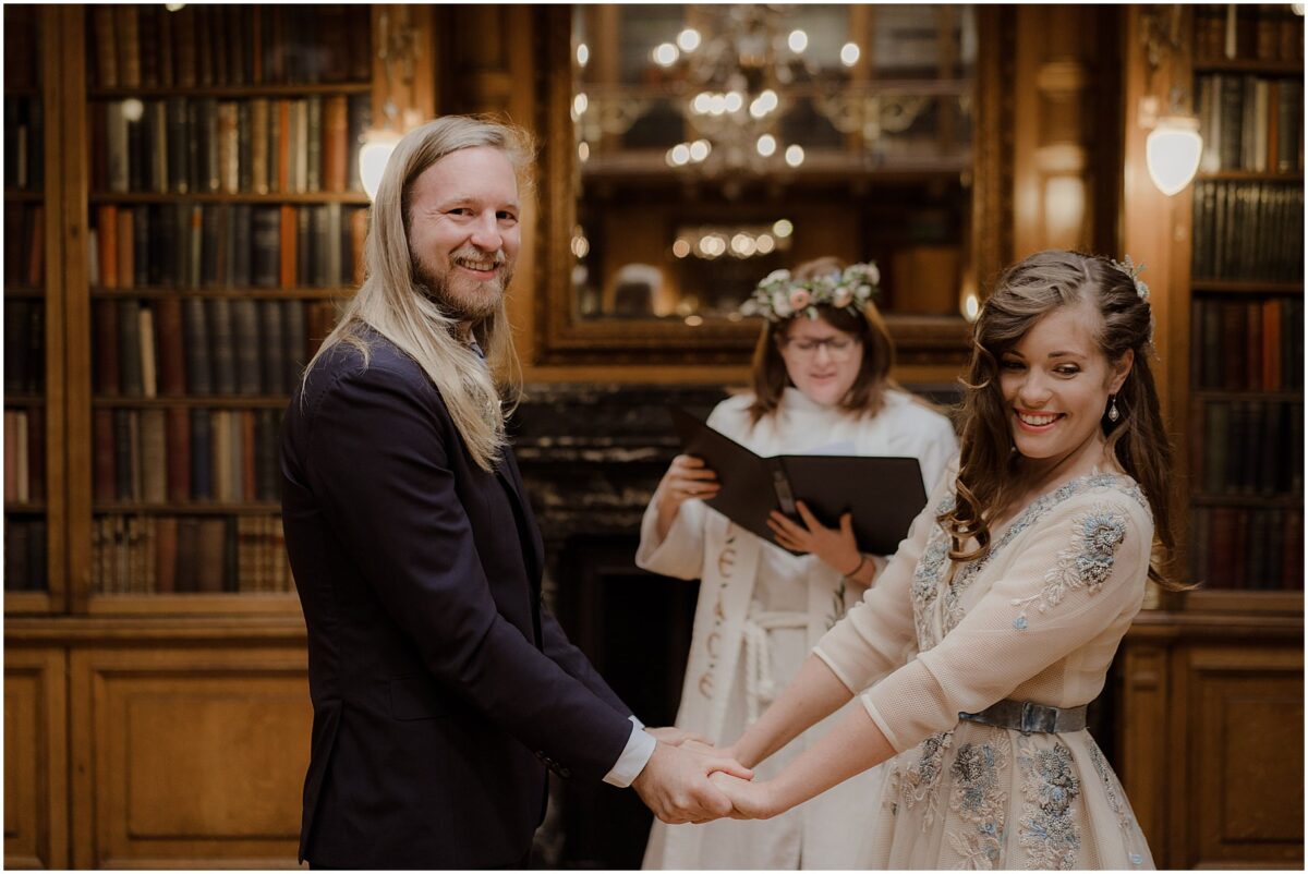 Bride and groom glancing at the guests