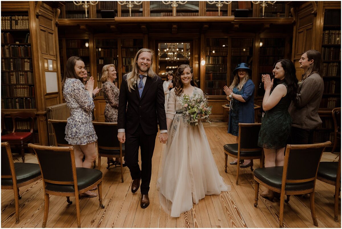 Newlyweds walking down the aisle as man and wife