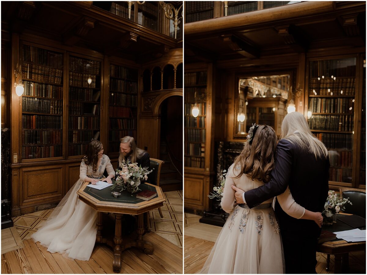 Bride and groom signing marriage register at a table
