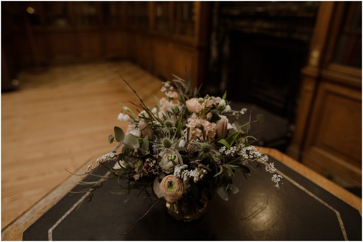 Wildflower bridal bouquet sitting on a dark green table