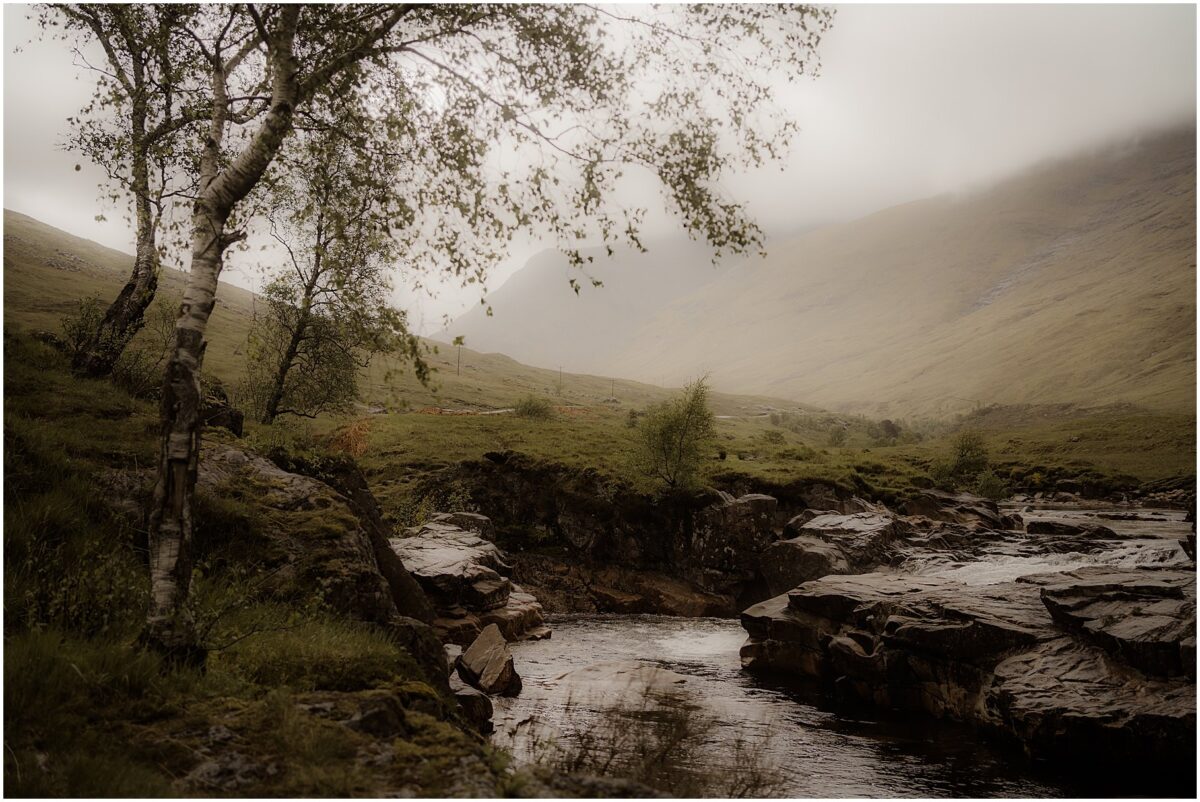 Silver birches lean over the mossy banks of the Etive river