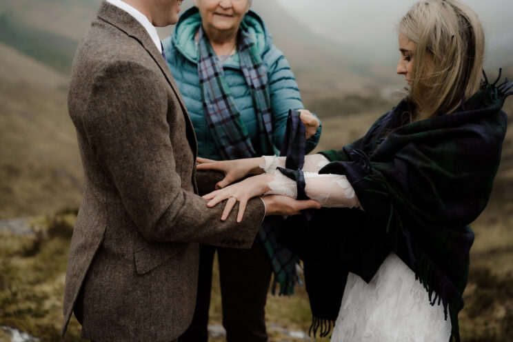 Hand-fasting at a mountain elopement in Scotland