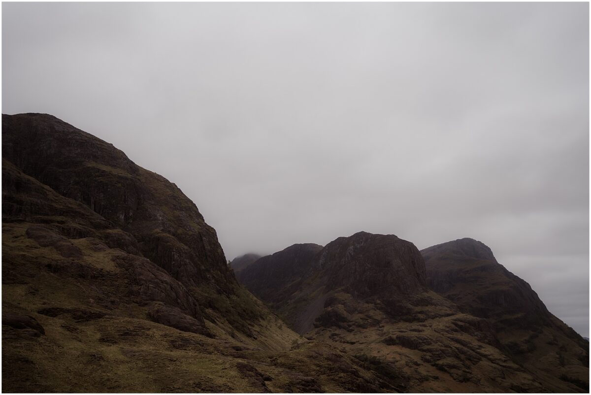 Misty Glencoe mountains rising under a brooding sky, draped in low clouds