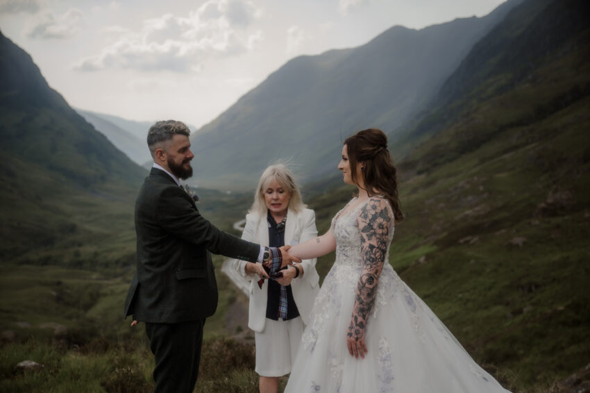 Handfasting ceremony with bride and groom at the Three Sisters in Scotland