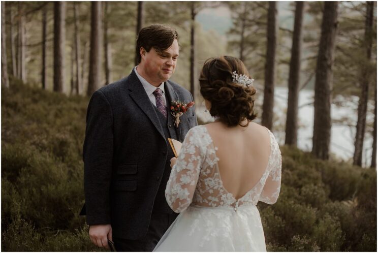 Bride and groom exchanging wedding vows at Loch an Eilein elopement in the Cairngorms