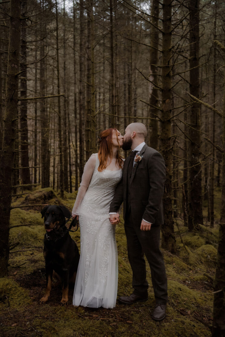 Wedding in the Scottish highlands - bride and groom with their dog