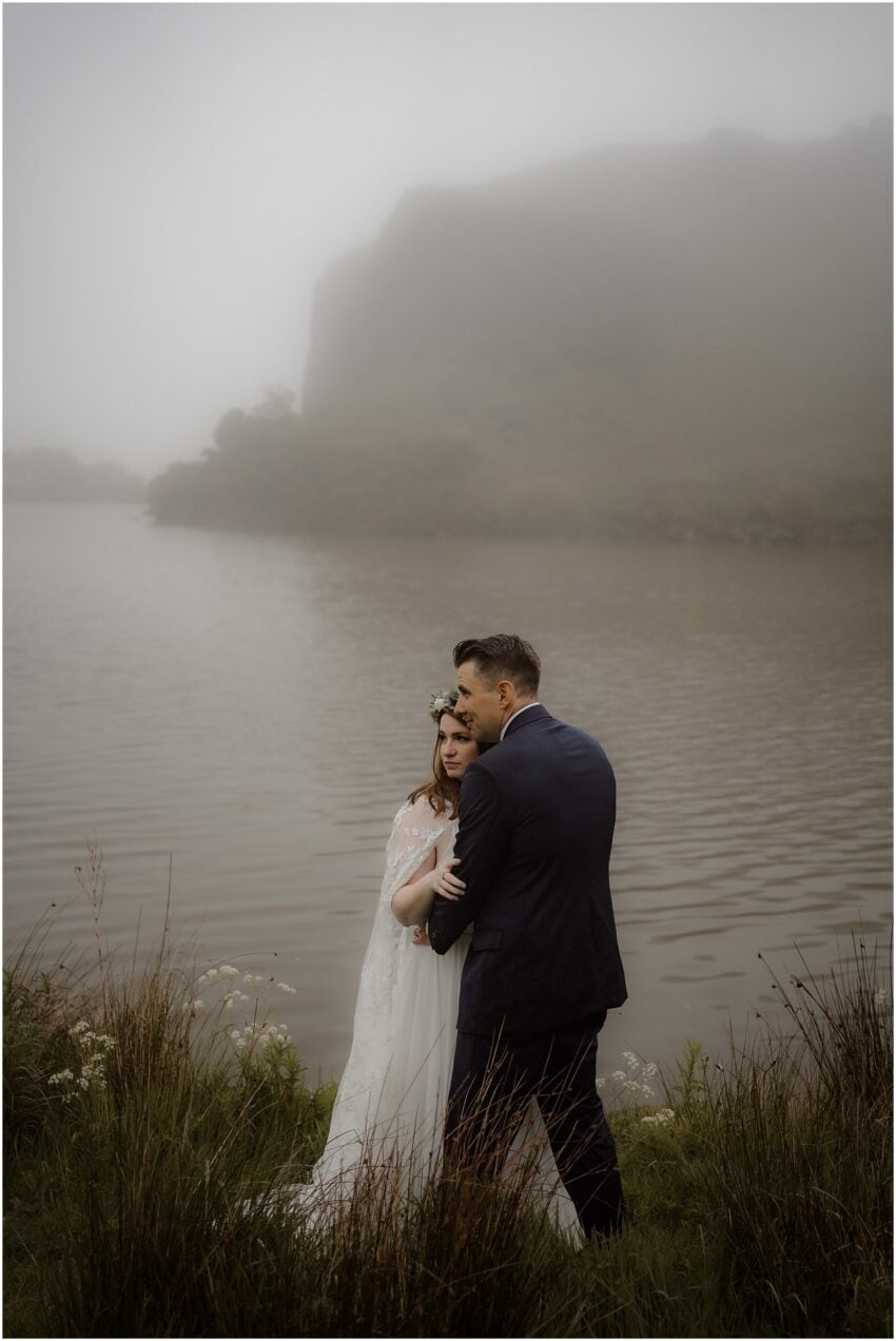 Misty outdoor wedding ceremony at Dunsapie Loch in Edinburgh, Scotland