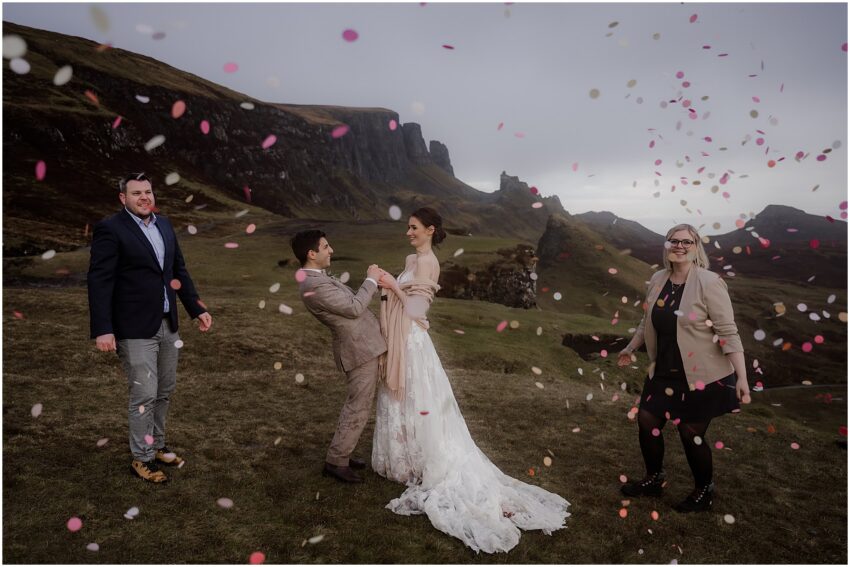 Wedding guests throwing confetti and bride and groom at Quiraing