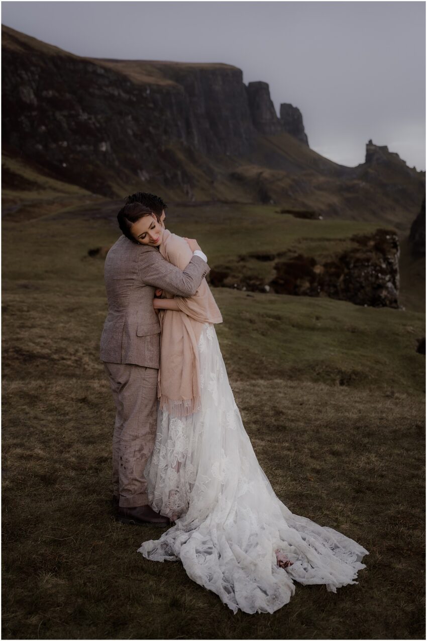 Bride and groom sharing an embrace after their Isle of Skye Quiraing elopement