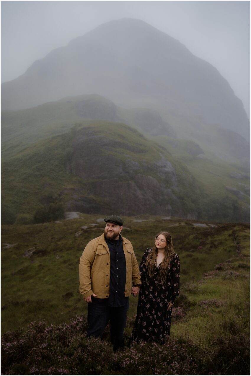 Couple standing near a mountain in Highlands - summer couple photoshoot in the highlands of Scotland