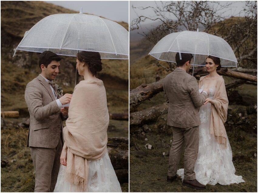 Bride and groom exchanging emotional wedding vows under an umbrella, during their elopement ceremony at Isle of Skye
