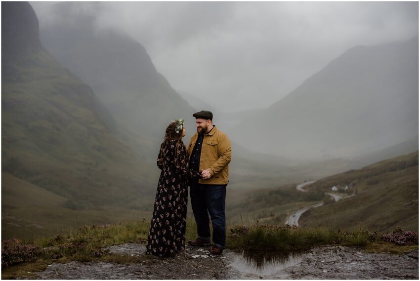 Couple holding hands in Scottish Highlands