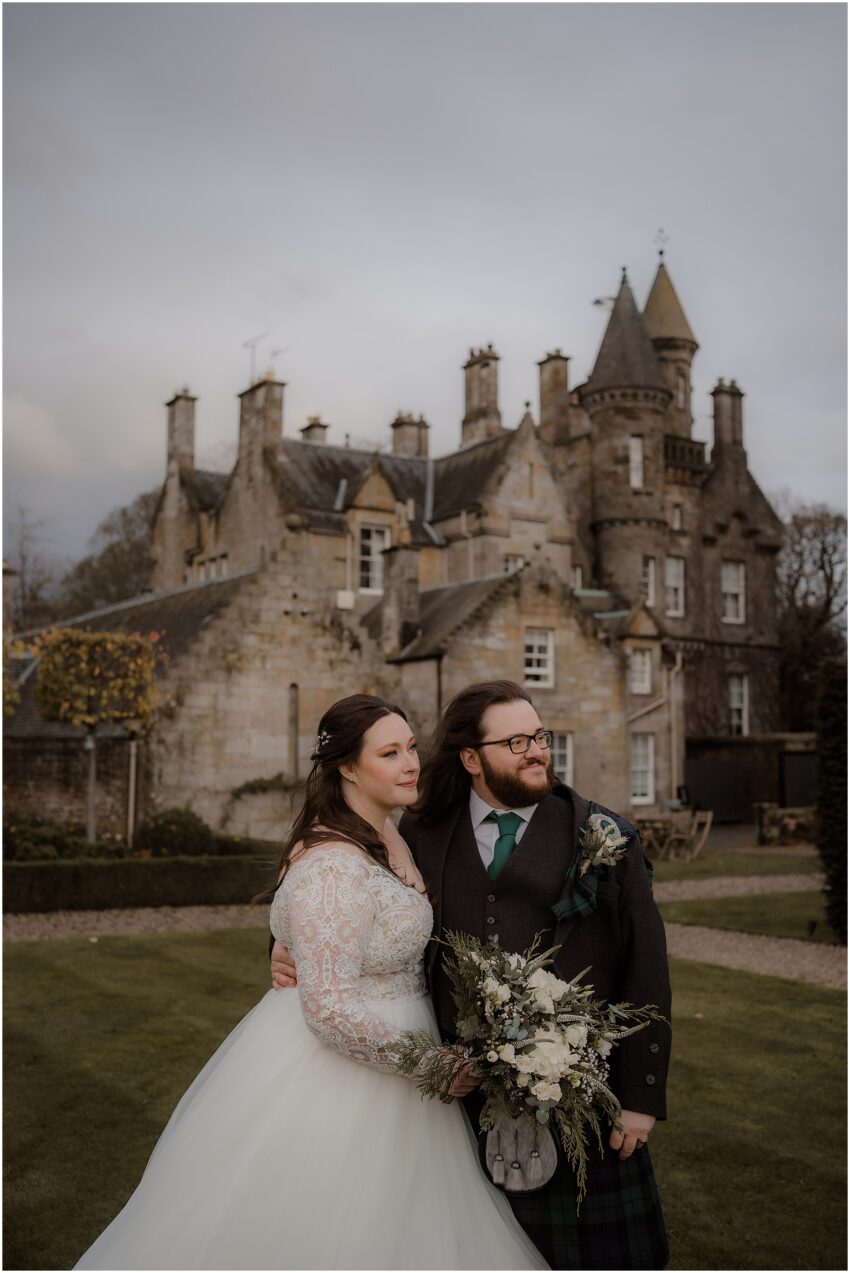 Wedding photoshoot of bride and groom in Carlowrie Castle in Scotland