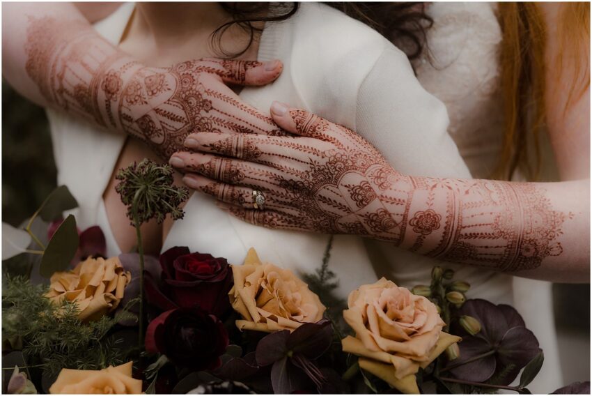 Henna-painted hands of the bride