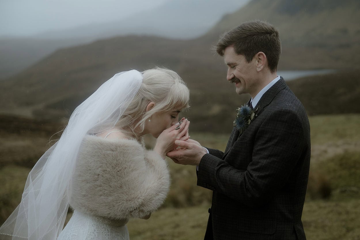 Bride taking a sip of whisky from the quaich - Quiraing quaich ceremony on Isle of Skye