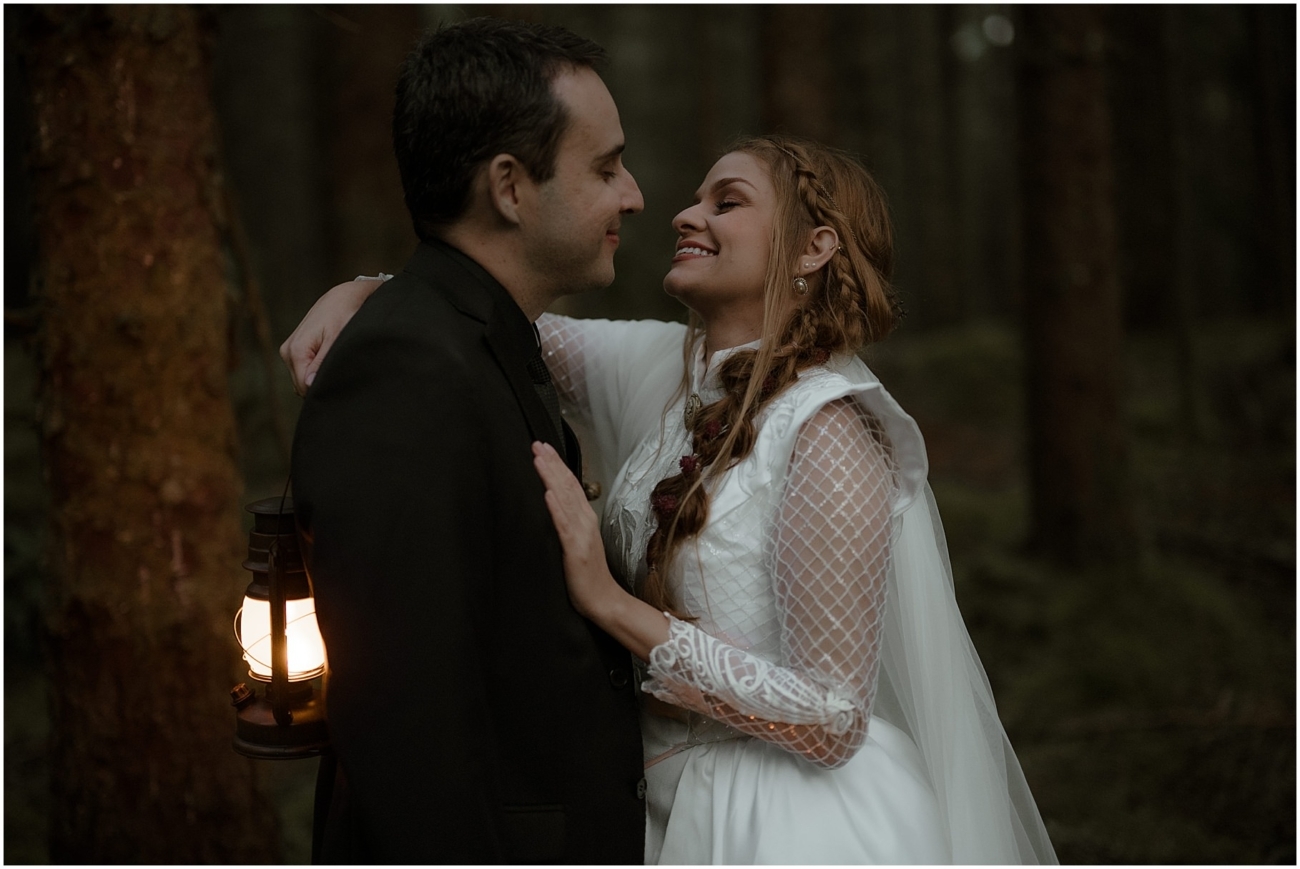 Fairytale wedding photos with lanterns in the forest of Glencoe