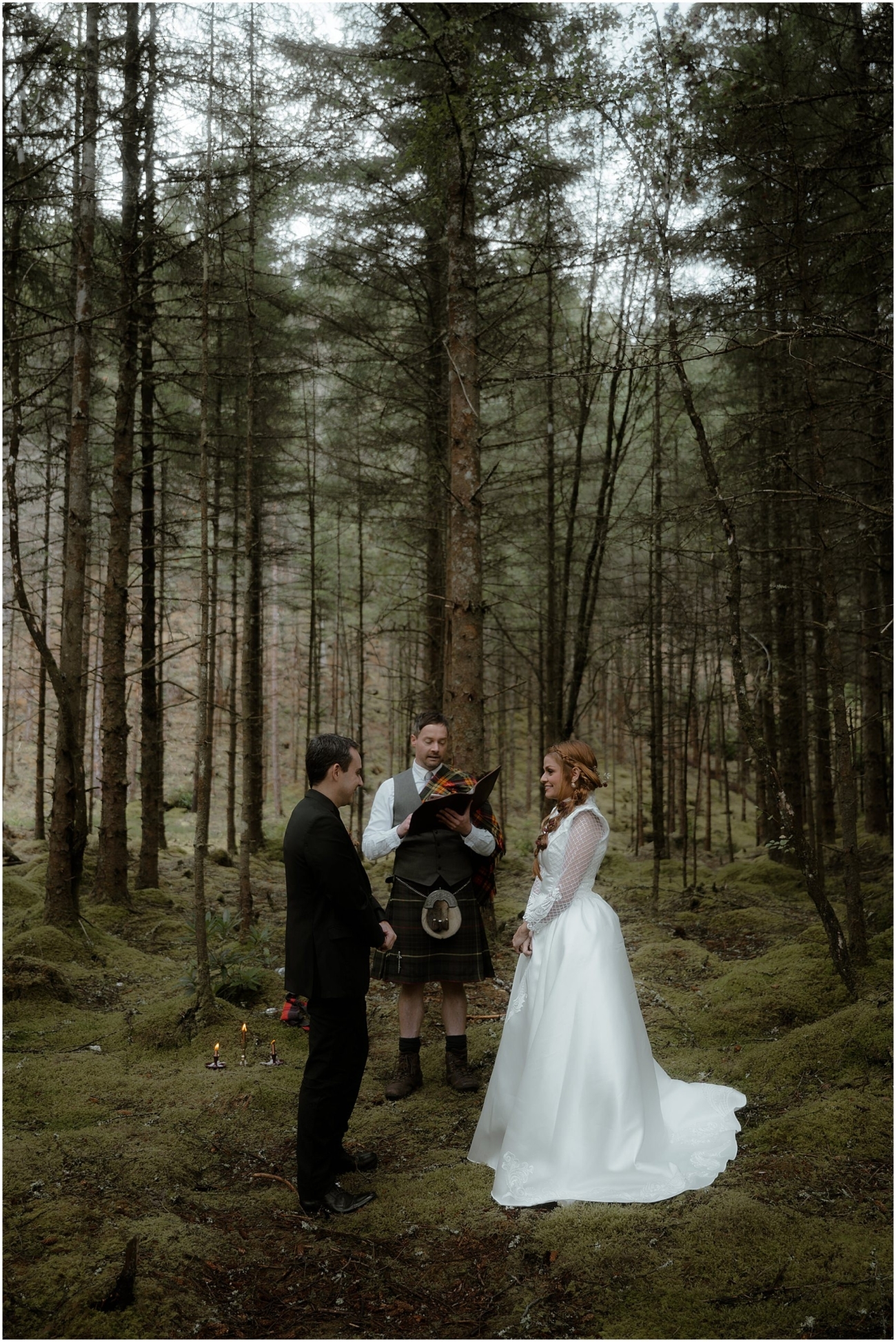 Autumn woodland wedding ceremony with handfasting and letter reading in Glencoe, Scotland