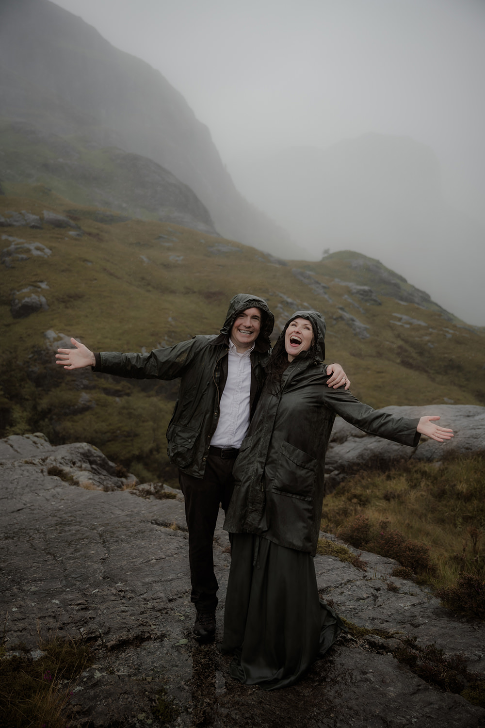 Advice for Rainy Wedding Days in Scotland - turn rain into romance 2 Bride and groom laughing uncontrollably in the downpour on their wedding day