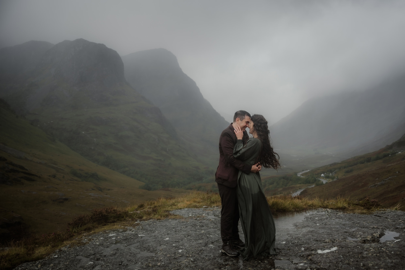 Advice for Rainy Wedding Days in Scotland - turn rain into romance 1 Bride and groom embracing on their rainy wedding day in Glencoe, Scotland