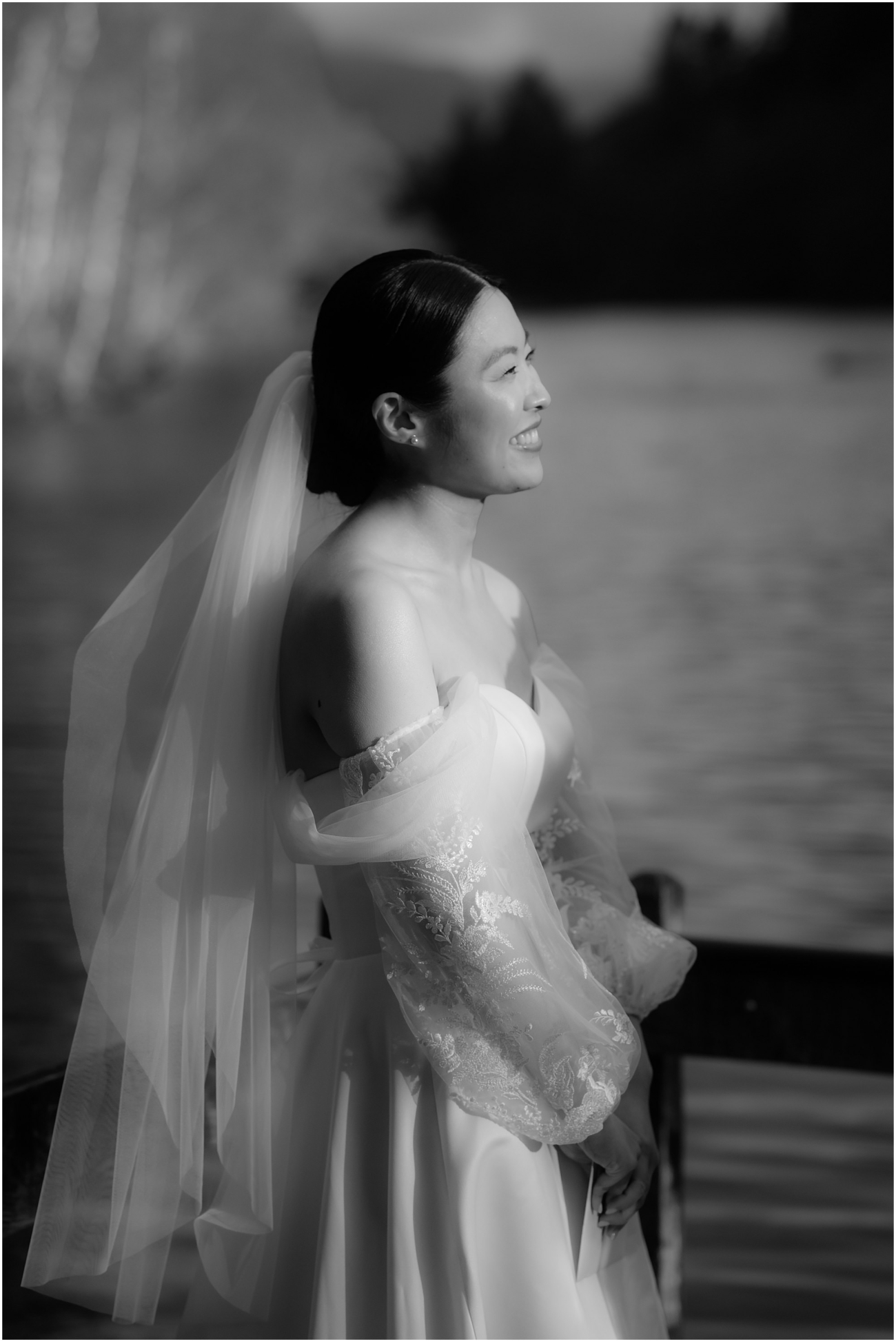 Bride smiling joyfully as she gazes at her partner