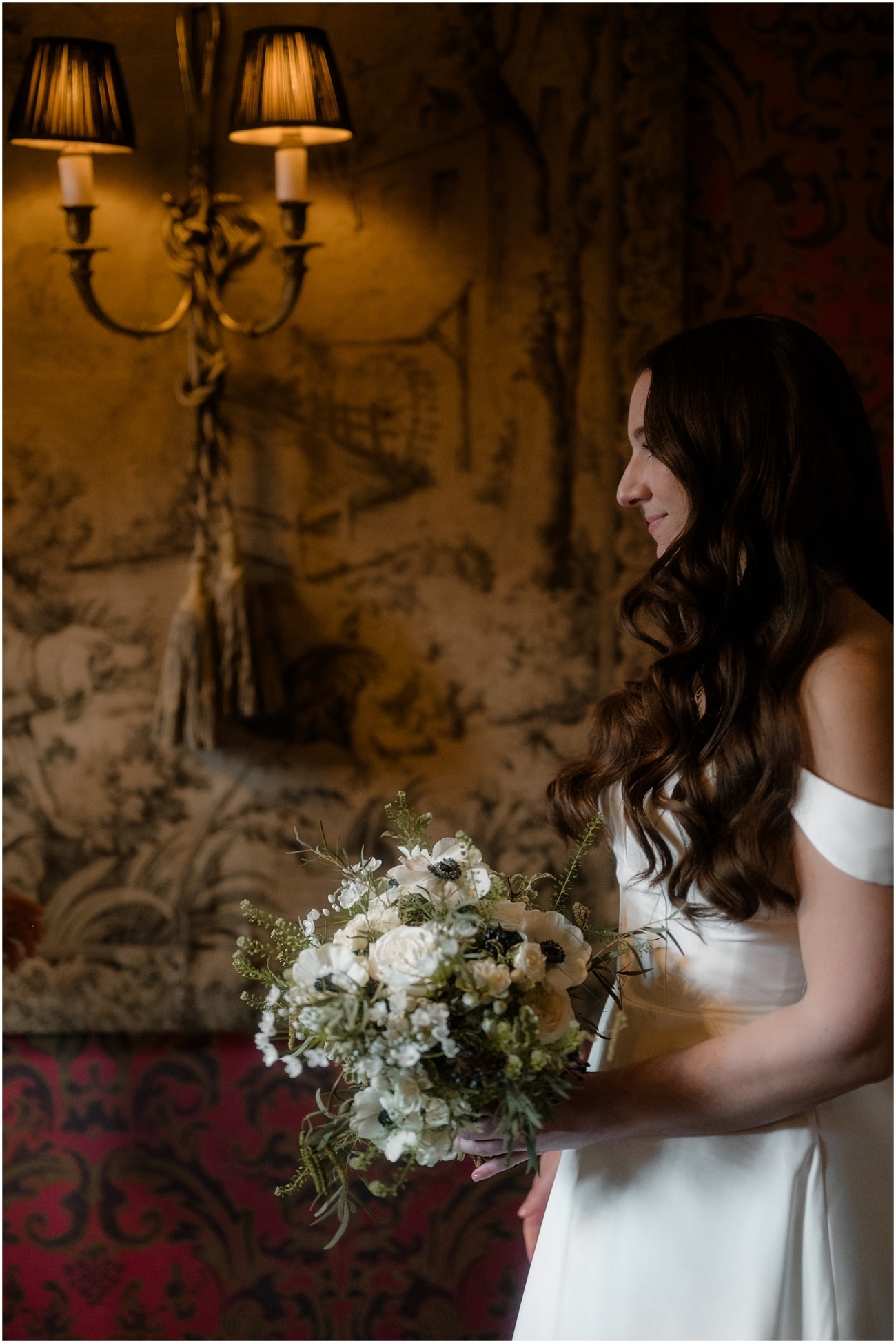 Close-up portrait of the bride standing by the window at the Witchery in Edinburgh