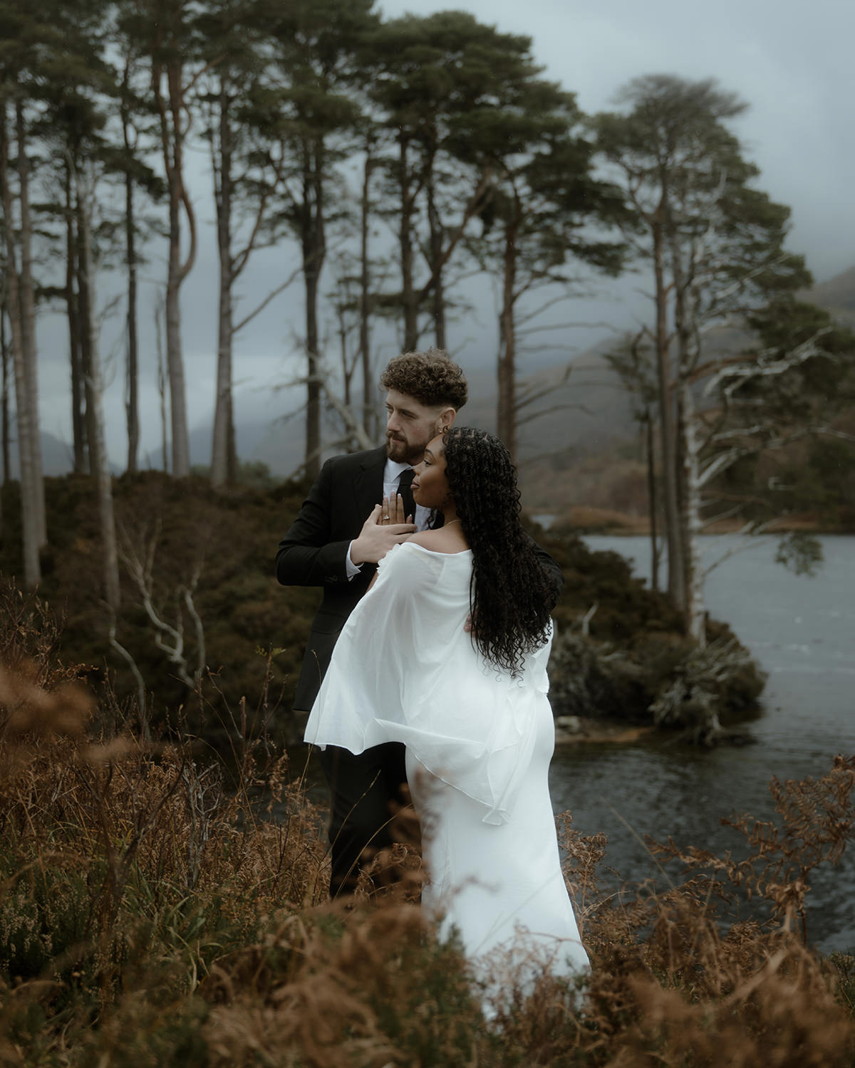 Bride and groom embracing during their Loch Eilt elopement session
