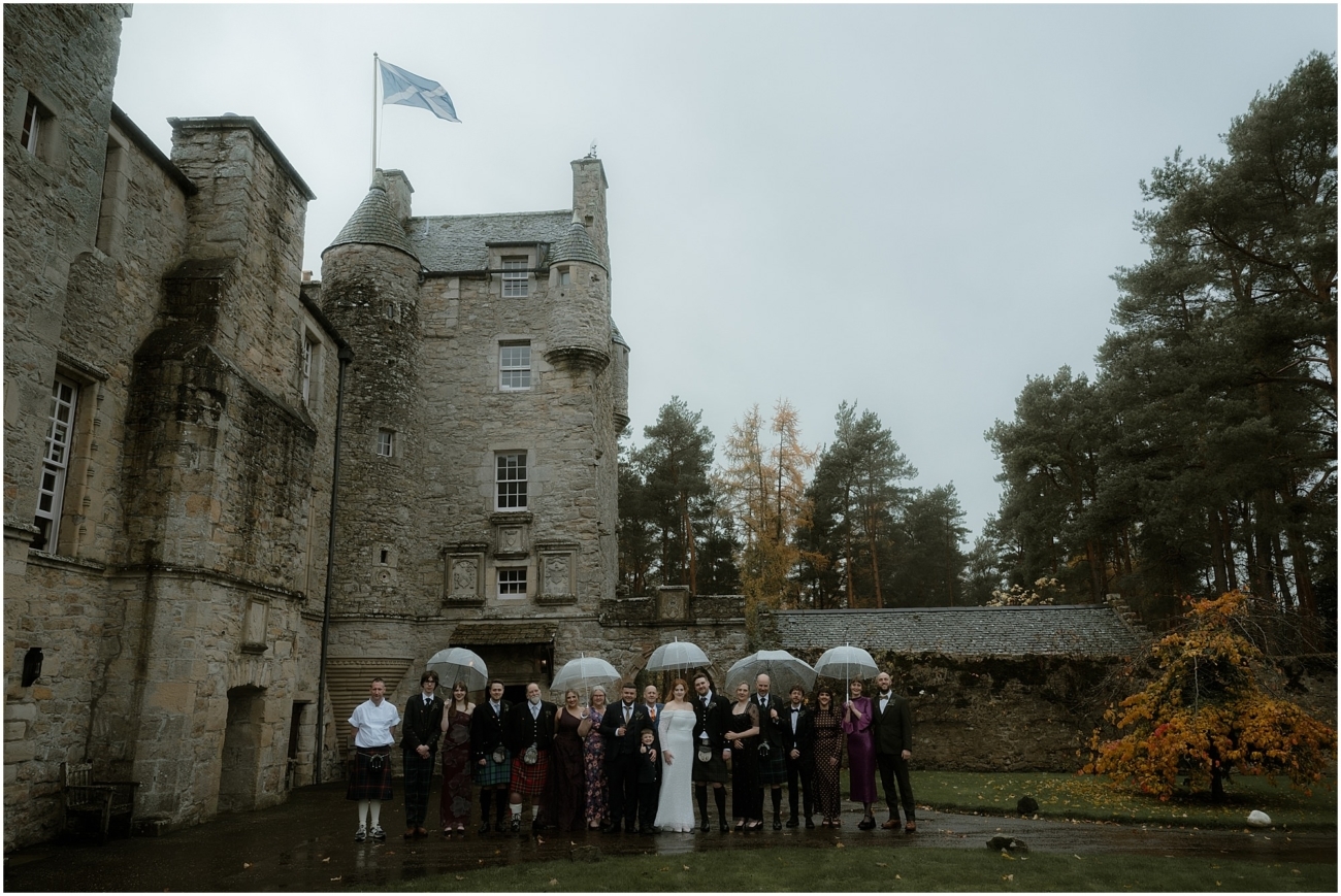 Cosy & Intimate Wedding at Ferniehirst Castle in the Scottish Borders 15 Small wedding group photo outside Ferniehirst Castle in the Scottish Borders