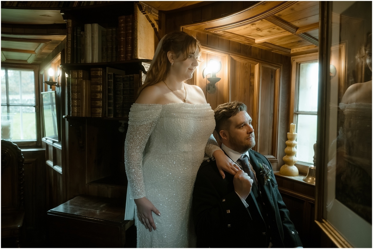 Cosy & Intimate Wedding at Ferniehirst Castle in the Scottish Borders 19 Close library portrait of the married couple