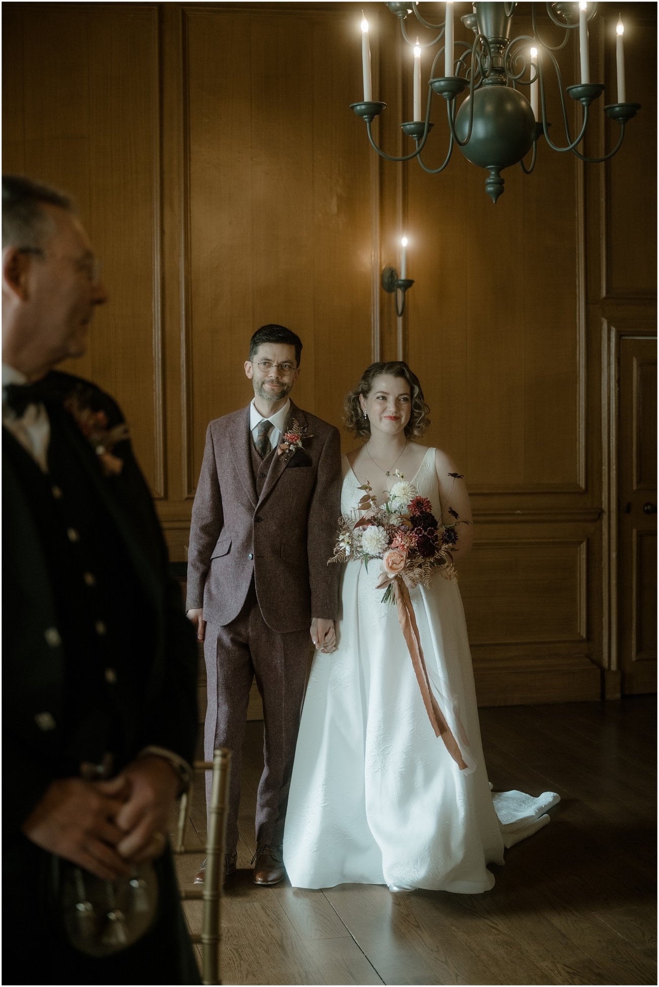 Couple standing together during their intimate Riddle’s Court wedding ceremony in the Geddes Room