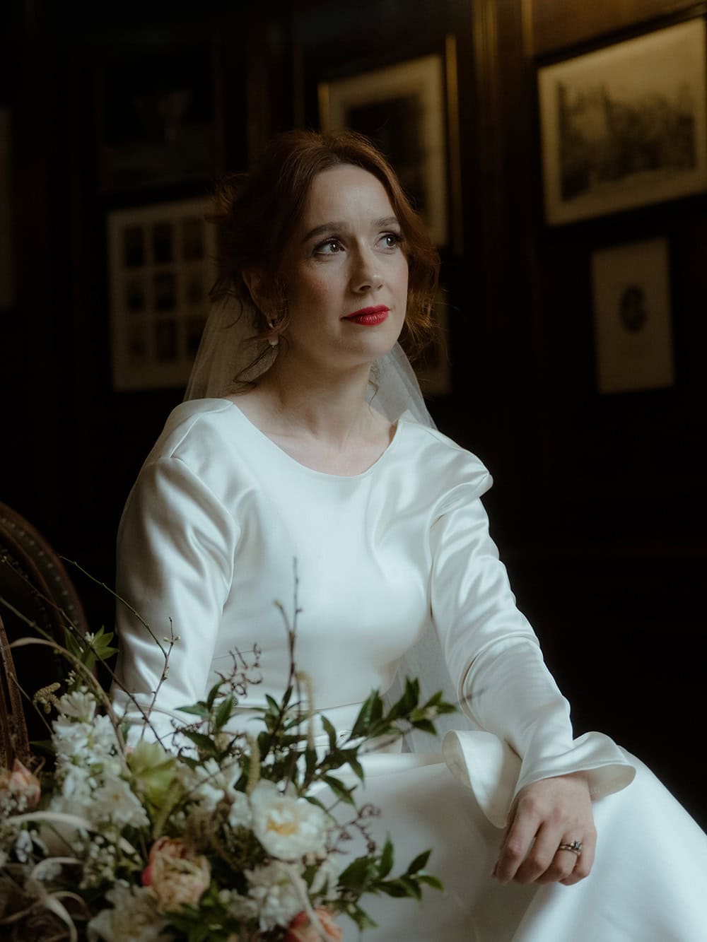 Weddings at the Royal College of Physicians Edinburgh: everything you need to know 16 Bride sitting in the corridor at the Royal College of Physicians Edinburgh, natural window light, holding a white and blush bouquet