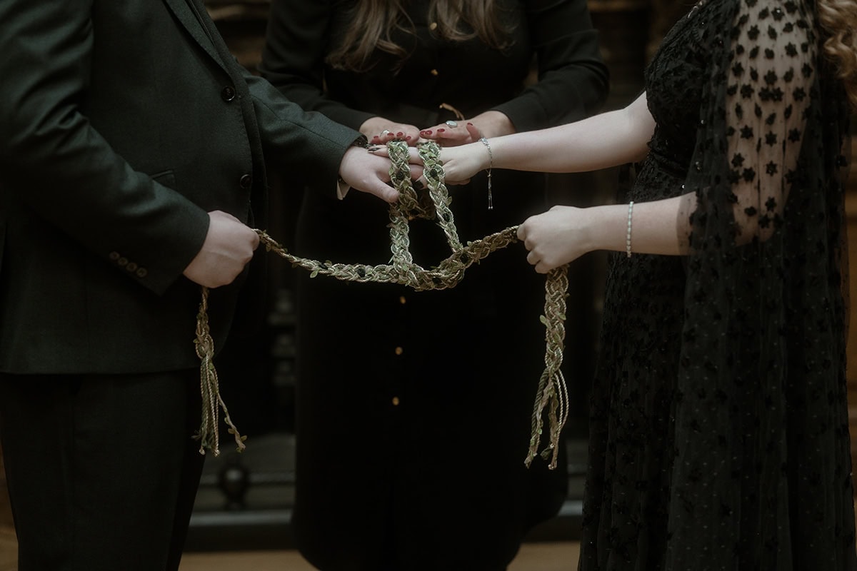 Weddings at the Royal College of Physicians Edinburgh: everything you need to know 13 Close-up of handfasting cord during wedding ceremony