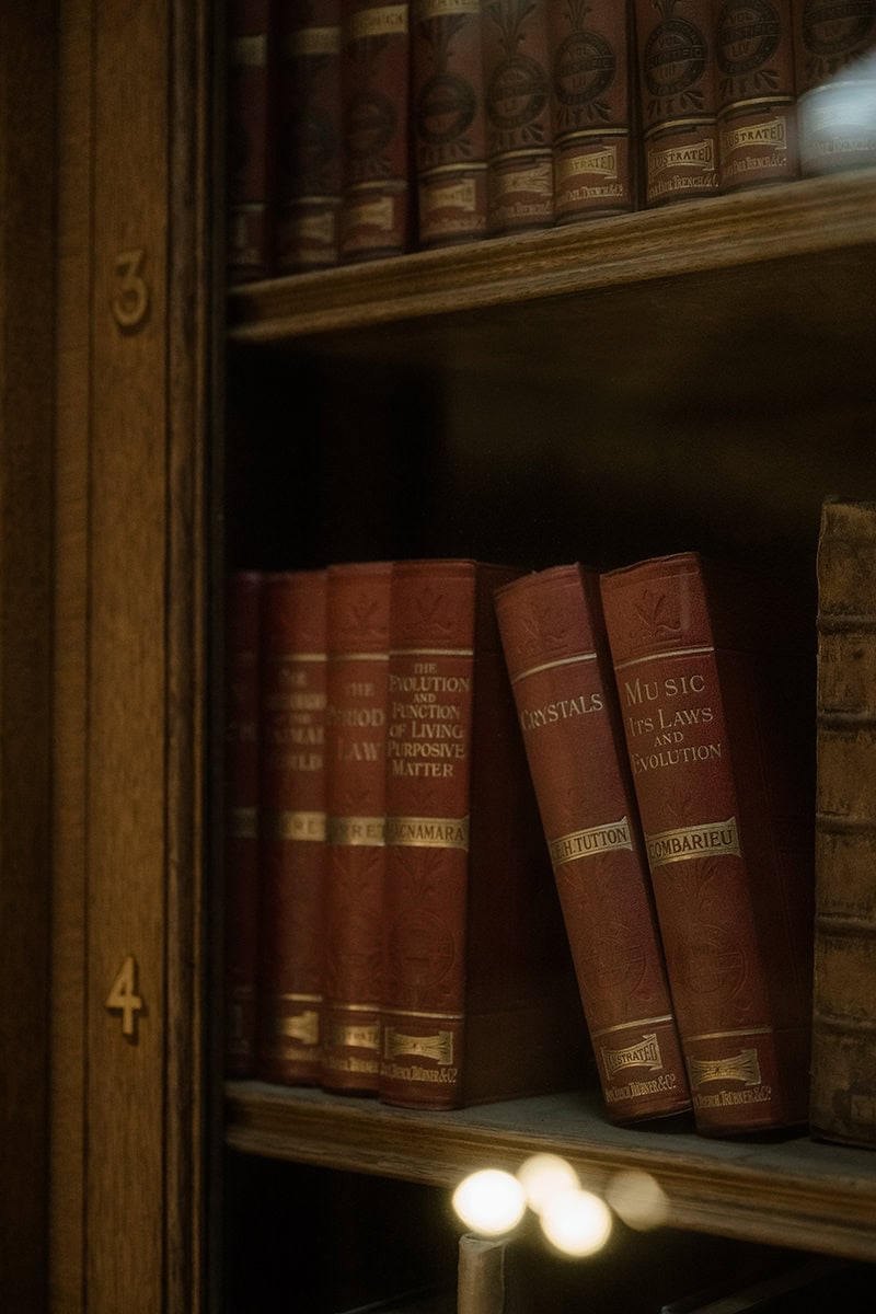 Close-up of antique leather-bound books on the shelves of the New Library at the Royal College of Physicians Edinburgh